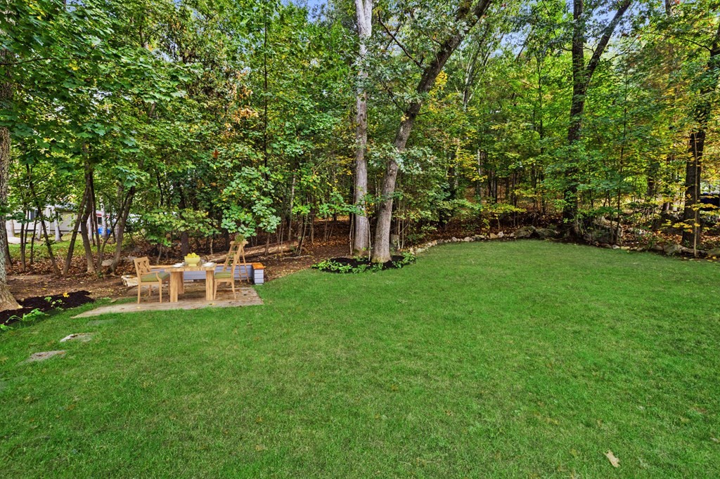 256 Great Road Maynard, MA 01754 - Photo 25 of 26 a view of a chair and table of the garden