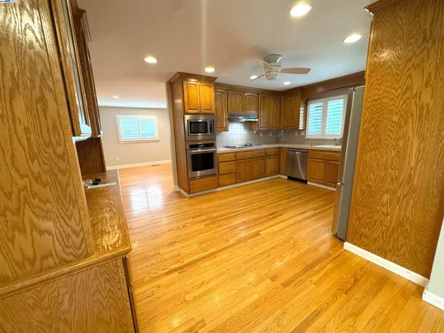 a view of kitchen with wooden floor