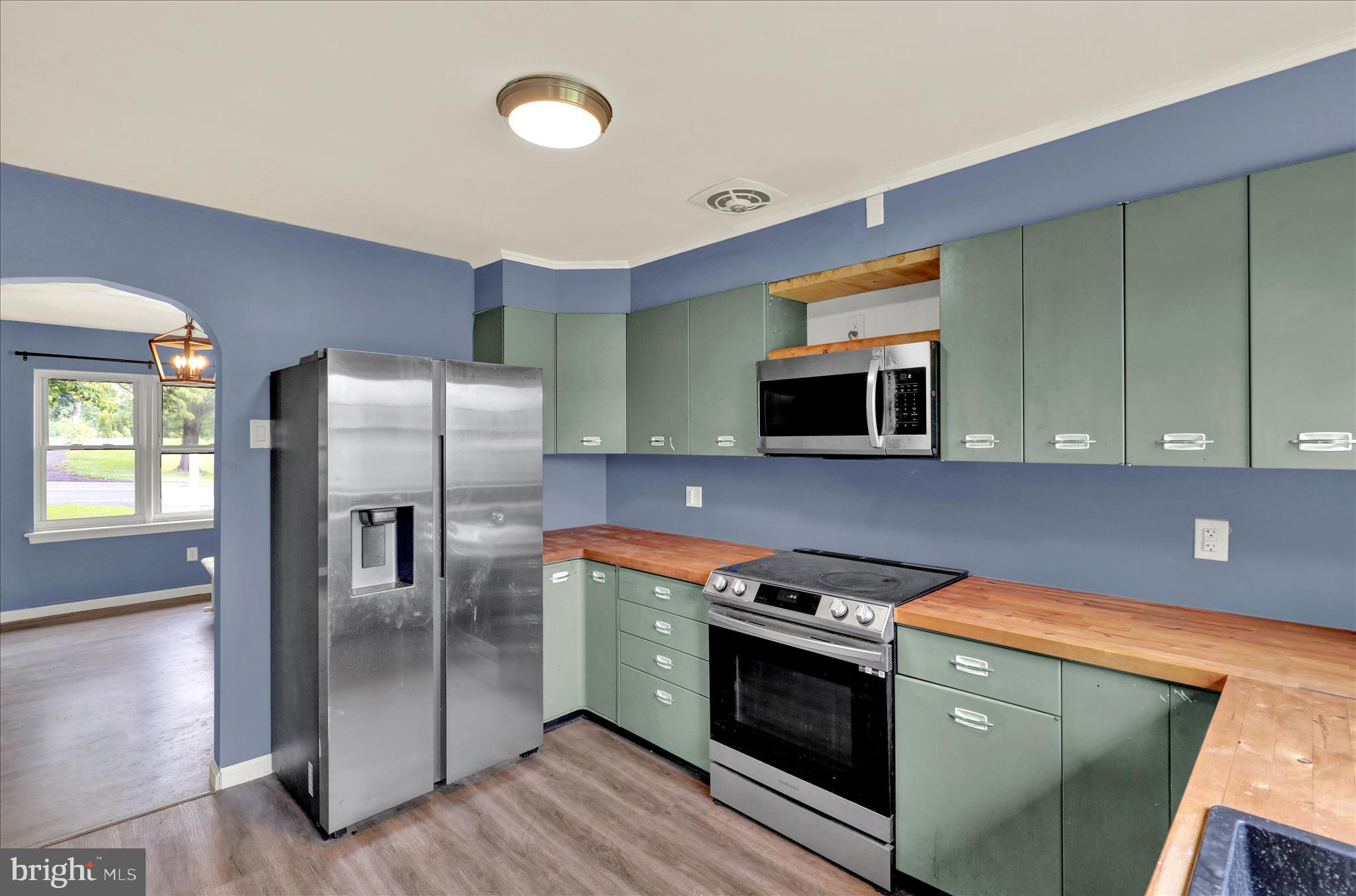 434 East Moyer Road Pottstown, PA 19464 - Photo 14 of 38 a kitchen with stainless steel appliances and wooden cabinets