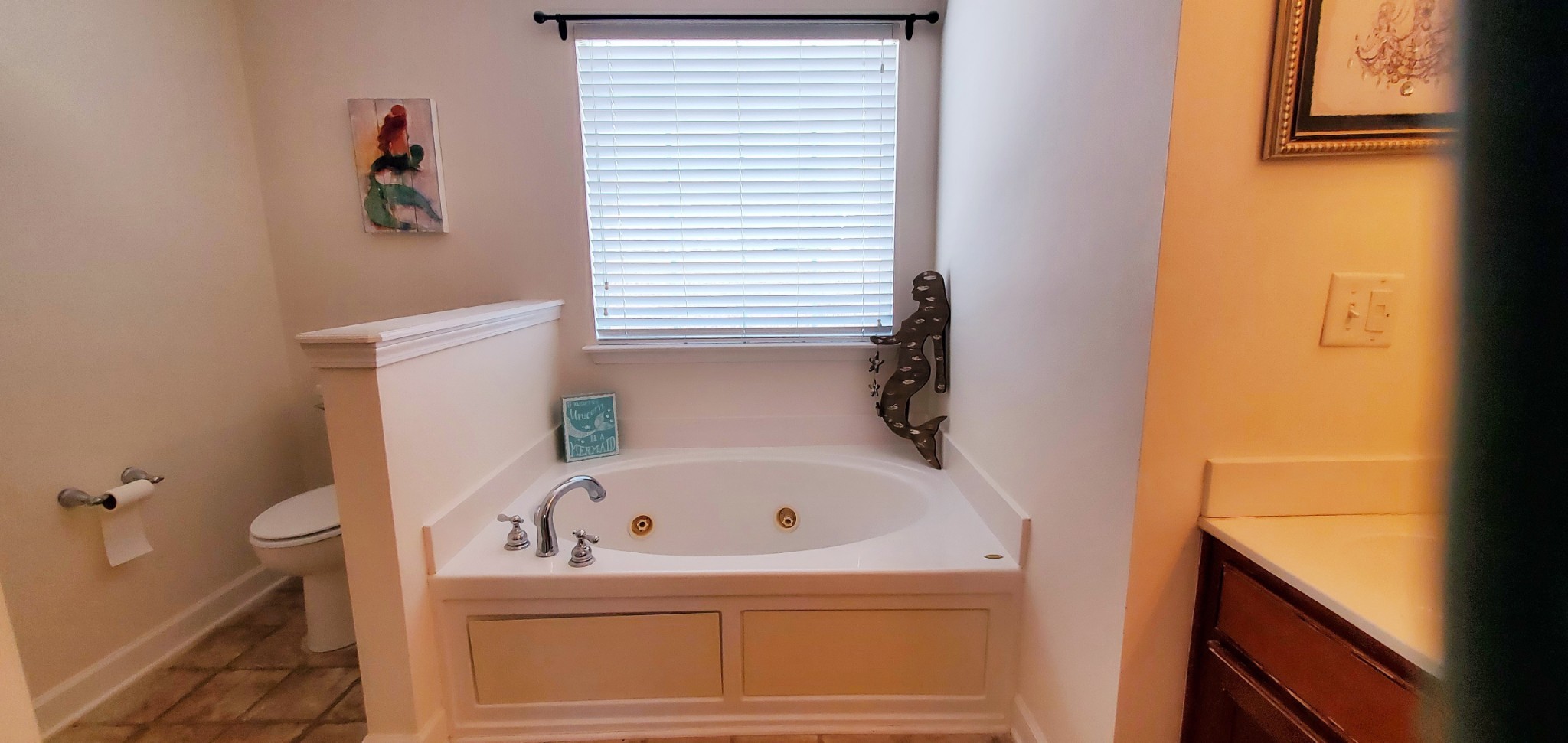 8008 Streamside Drive Mount Juliet, TN 37122 - Photo 14 of 35 a bathroom with a bathtub and a window