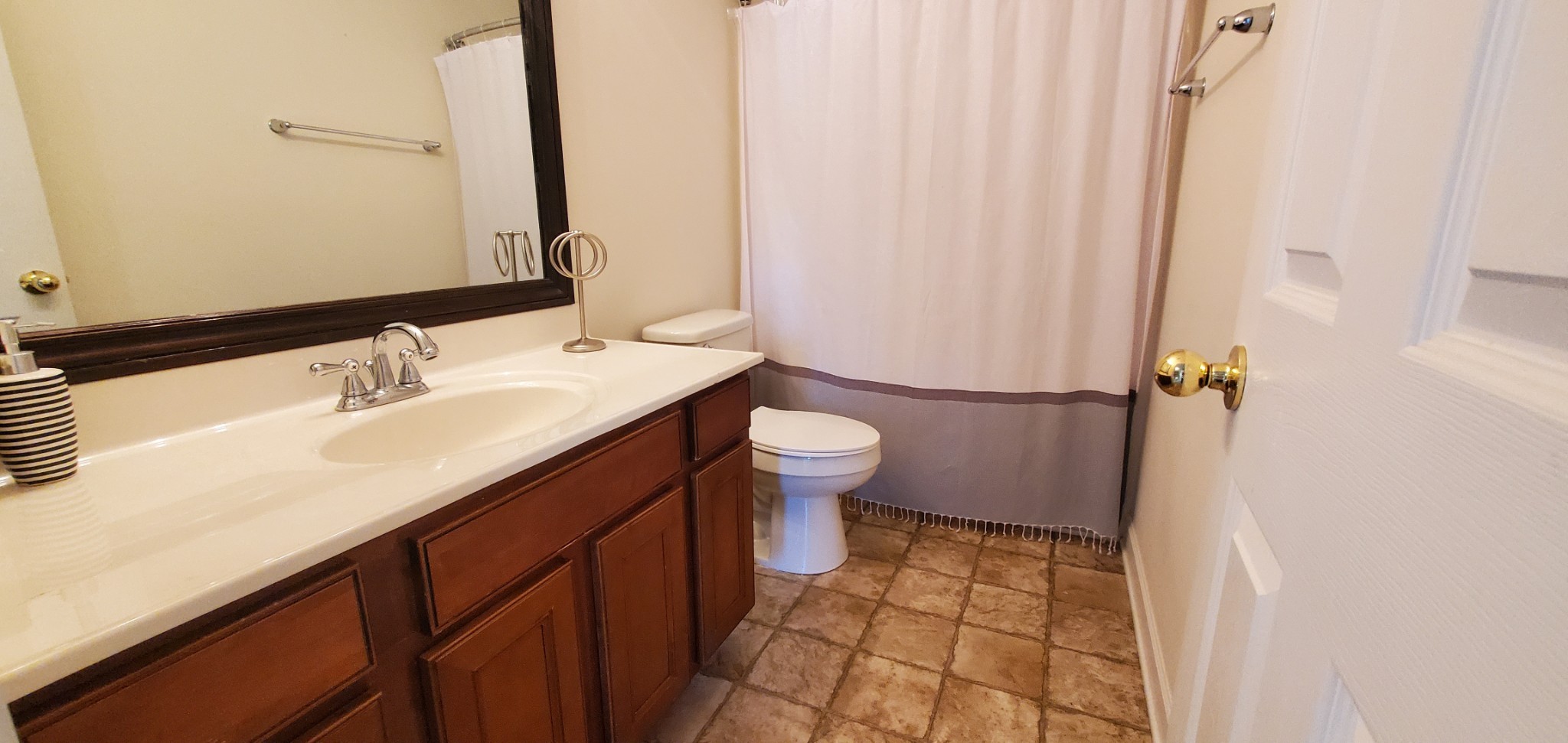 8008 Streamside Drive Mount Juliet, TN 37122 - Photo 18 of 35 a bathroom with a sink a toilet a shower and a mirror
