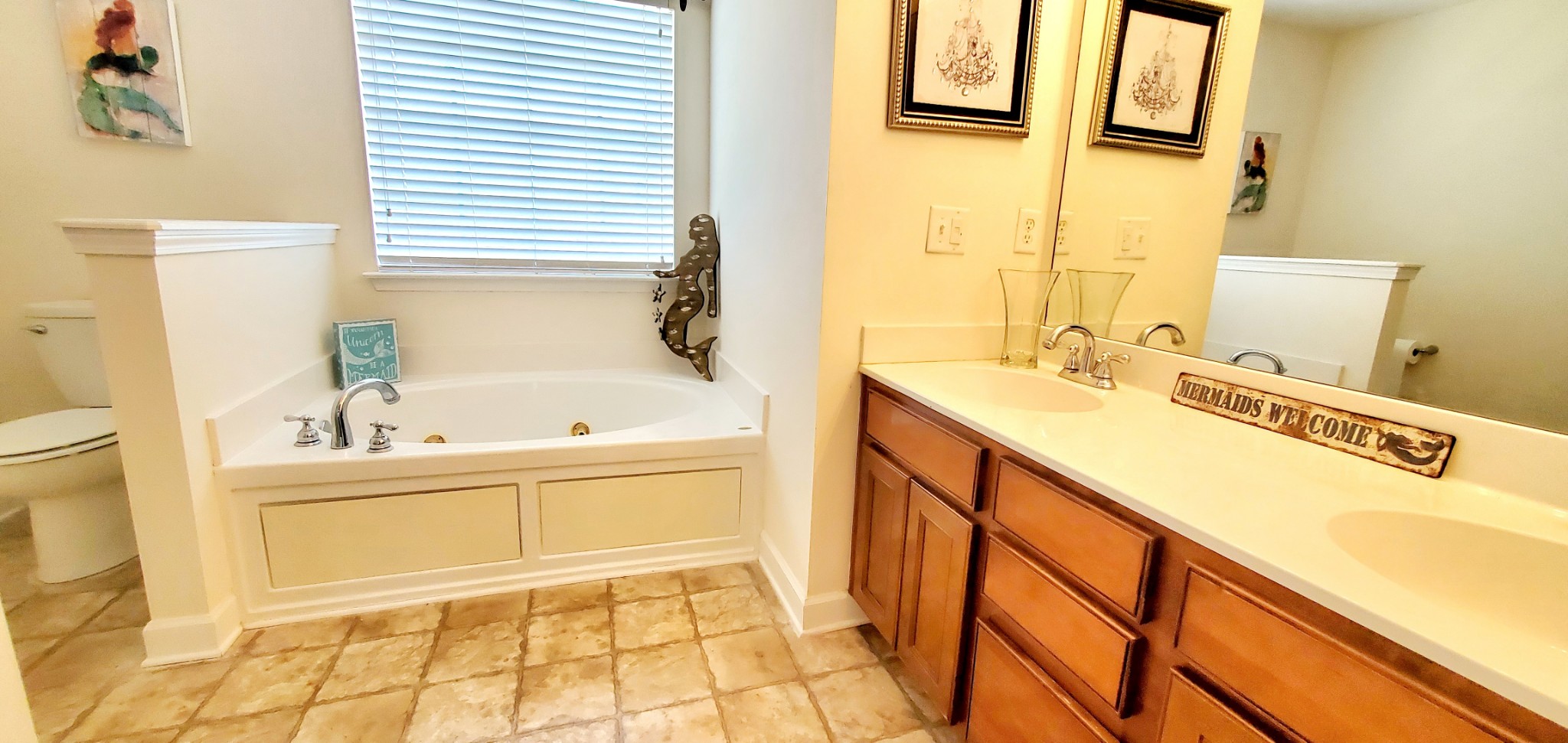 8008 Streamside Drive Mount Juliet, TN 37122 - Photo 30 of 35 a bathroom with a tub sink and a mirror