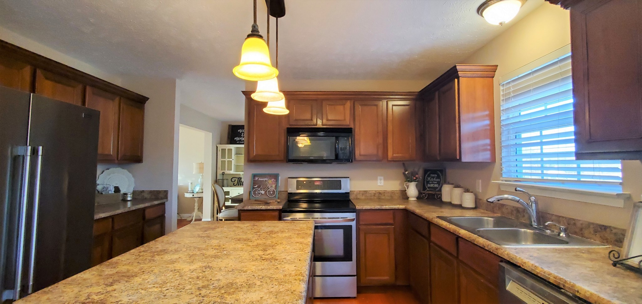 8008 Streamside Drive Mount Juliet, TN 37122 - Photo 5 of 35 a kitchen with a sink stove and refrigerator