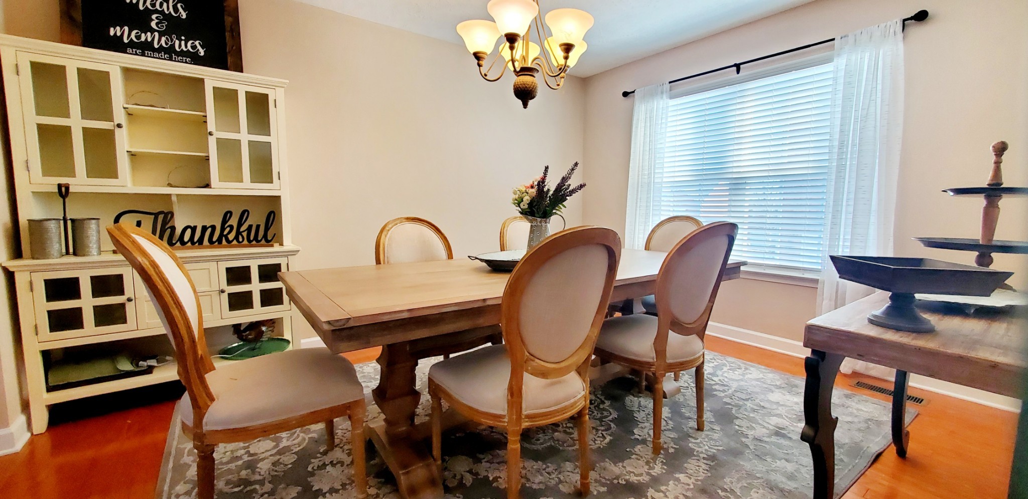 8008 Streamside Drive Mount Juliet, TN 37122 - Photo 7 of 35 a view of a dining room with furniture and a window