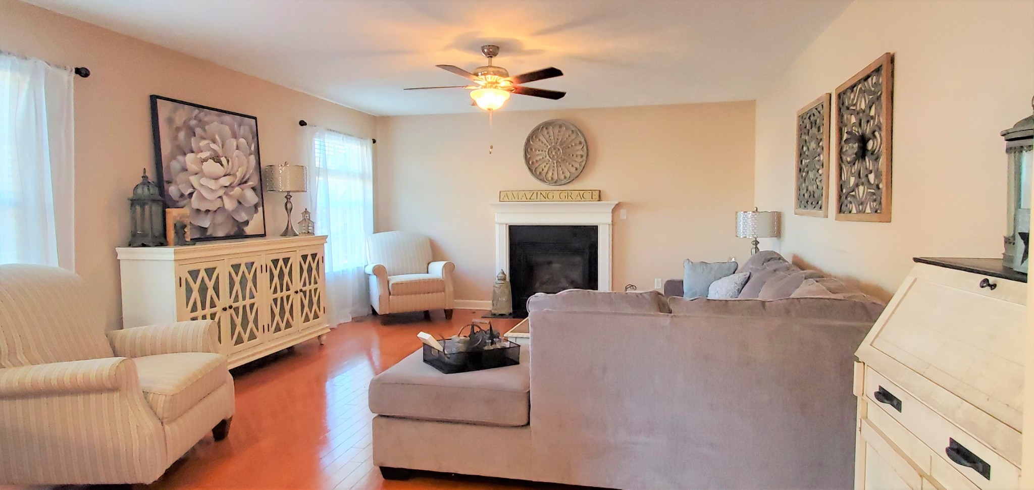 8008 Streamside Drive Mount Juliet, TN 37122 - Photo 8 of 35 a living room with furniture a fireplace and a window