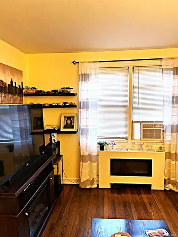 a living room with a stove and a table