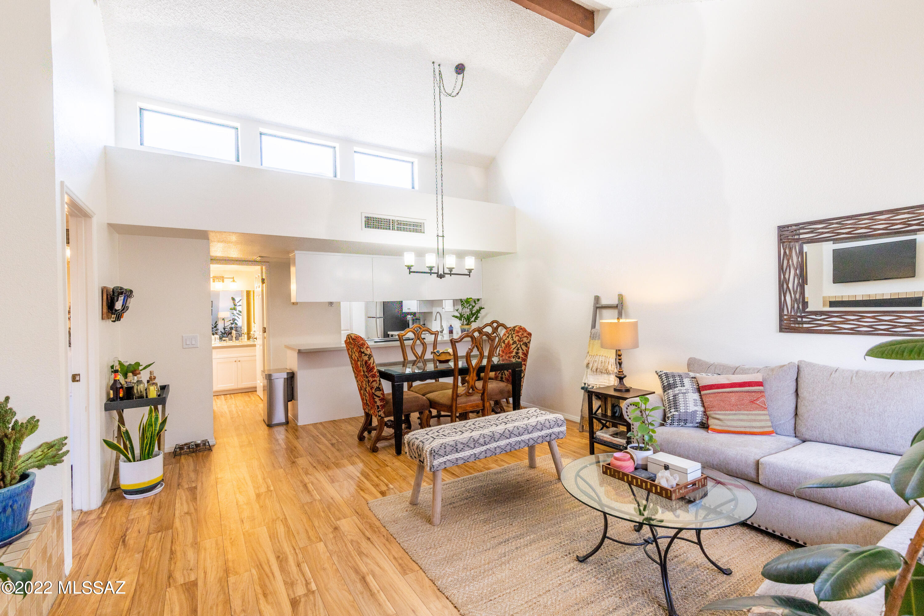 1200 East River Road, Unit F69 Tucson, AZ 85718 - Photo 1 of 22 a living room with furniture and wooden floor