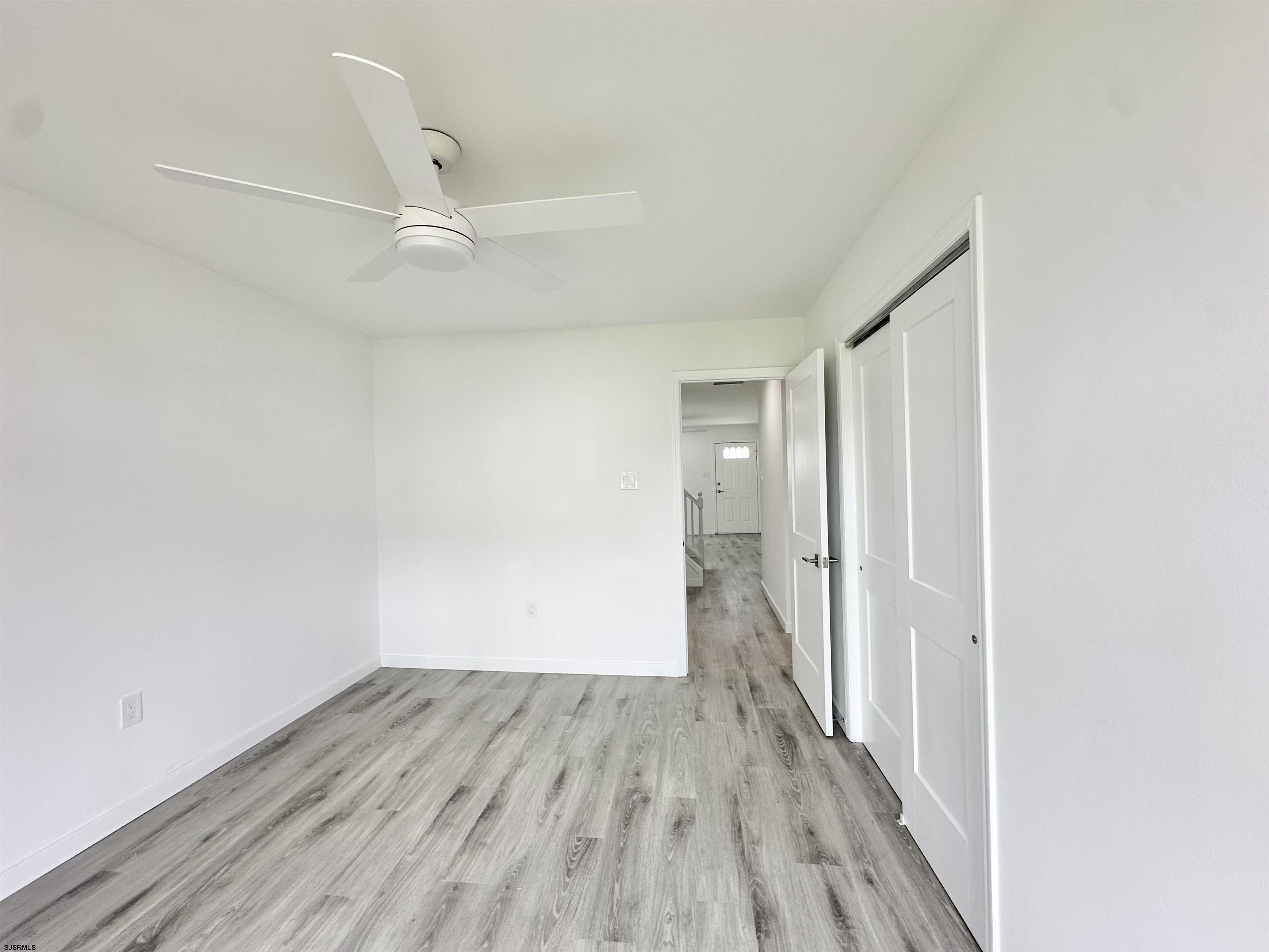 340 Seashell Lane Brigantine, NJ 08203 - Photo 23 of 47 a view of a hallway with wooden floor