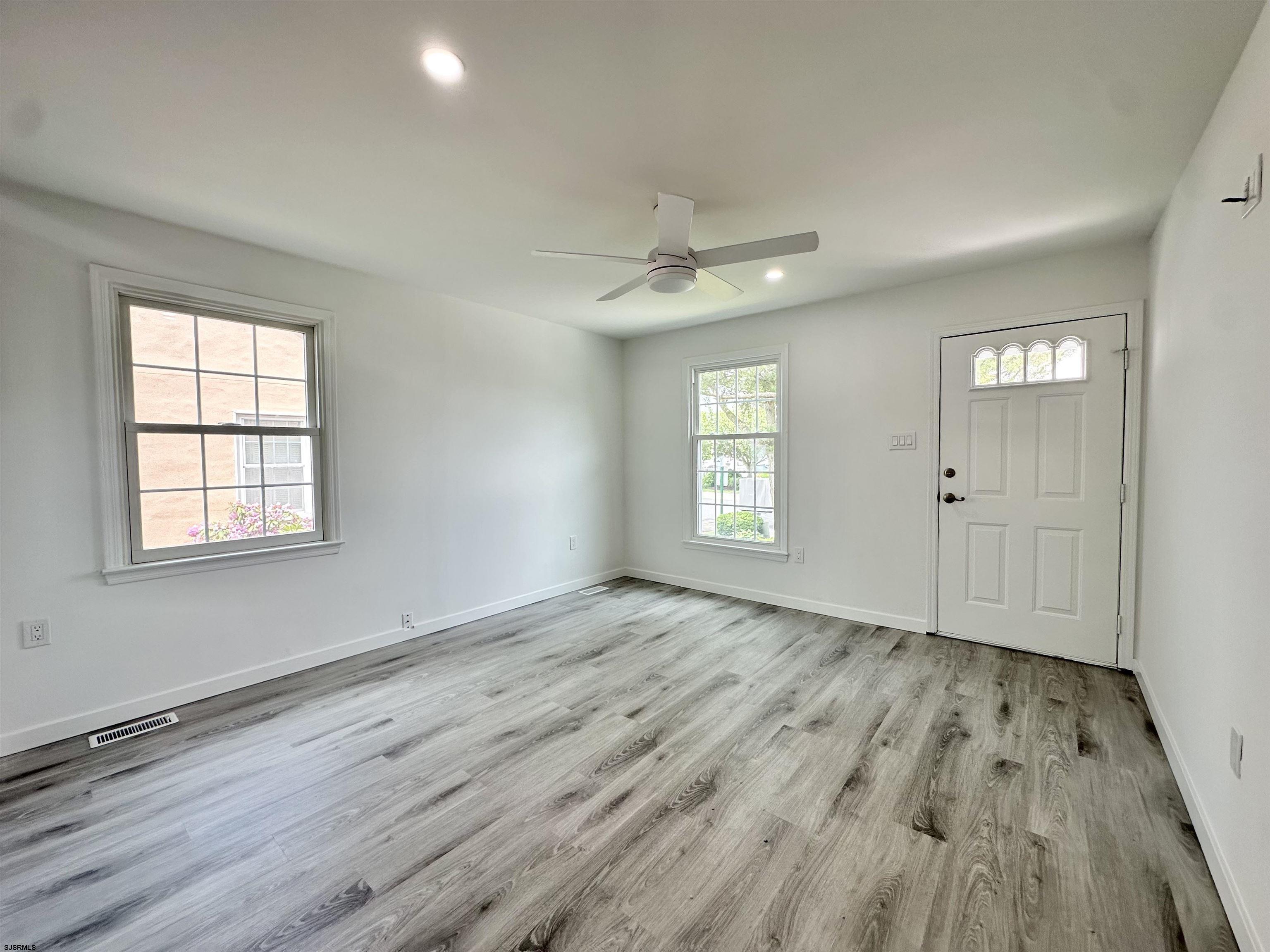 340 Seashell Lane Brigantine, NJ 08203 - Photo 32 of 47 wooden floor in an empty room with a window
