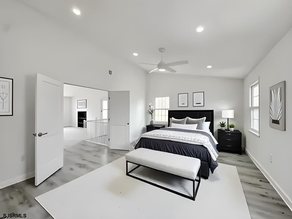 340 Seashell Lane Brigantine, NJ 08203 - Photo 37 of 47 a spacious bedroom with a bed and a couch