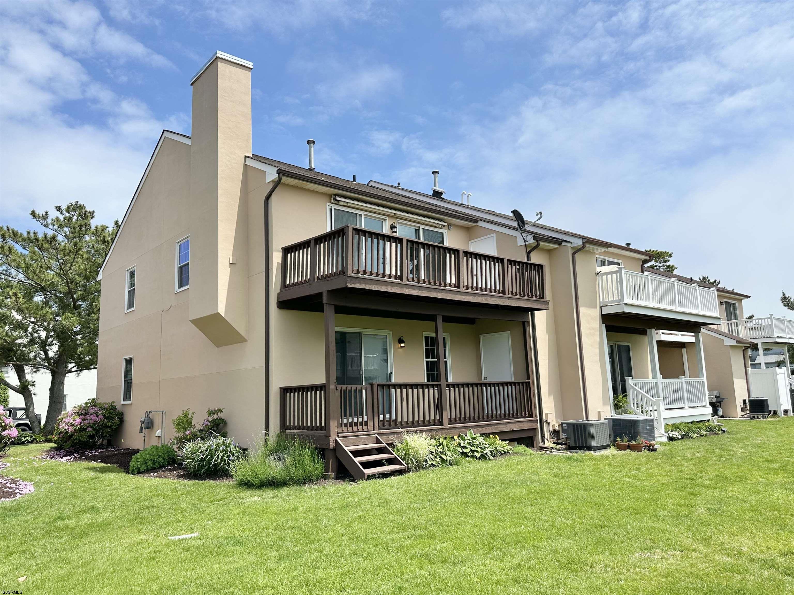 340 Seashell Lane Brigantine, NJ 08203 - Photo 42 of 47 a view of a house with a yard