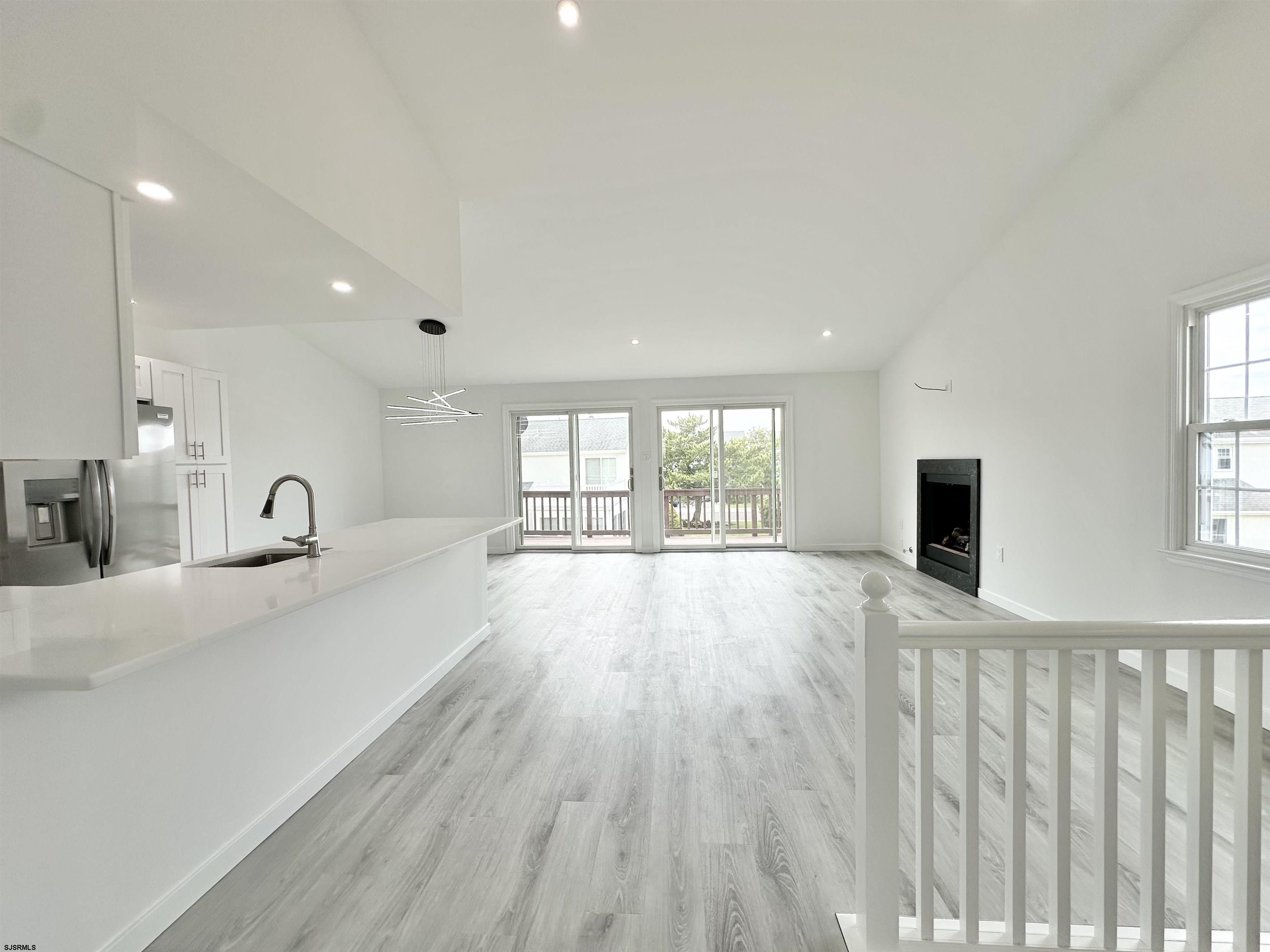 340 Seashell Lane Brigantine, NJ 08203 - Photo 43 of 47 a view of an empty room with a window and wooden floor