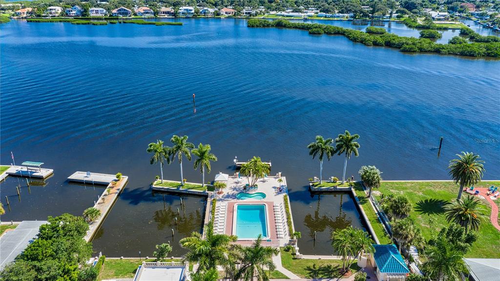 5963 Midnight Pass Road, Unit 332 Sarasota, FL 34242 - Photo 29 of 49 an aerial view of a house with pool garden