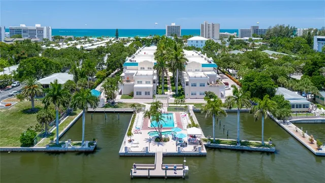 a small filled with lots of residential buildings and lake view