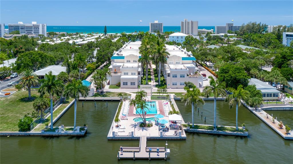 5963 Midnight Pass Road, Unit 332 Sarasota, FL 34242 - Photo 3 of 49 a small filled with lots of residential buildings and lake view