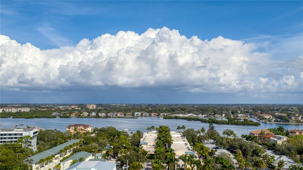5963 Midnight Pass Road, Unit 332 Sarasota, FL 34242 - Photo 35 of 49 a view of a lake and a mountain