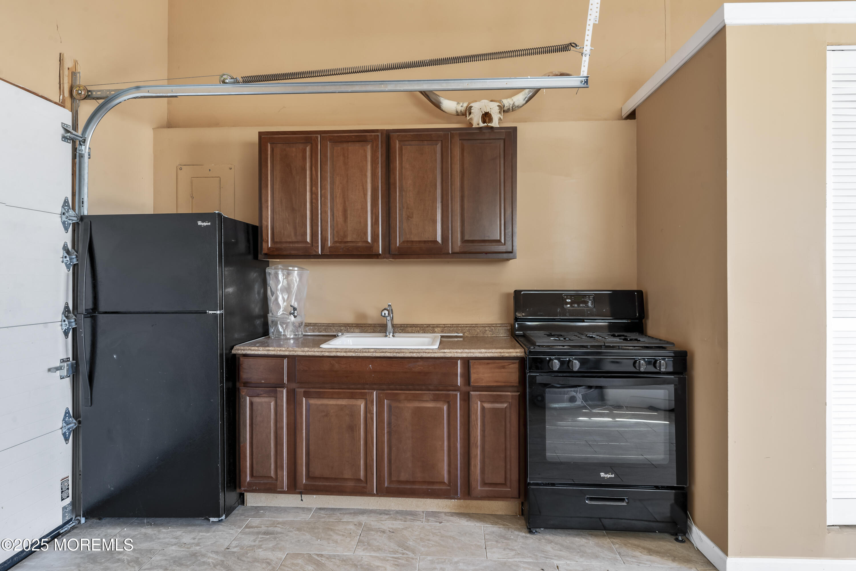 329 Front Street Union Beach, NJ 07735 - Photo 22 of 51 a kitchen with a refrigerator and a stove top oven
