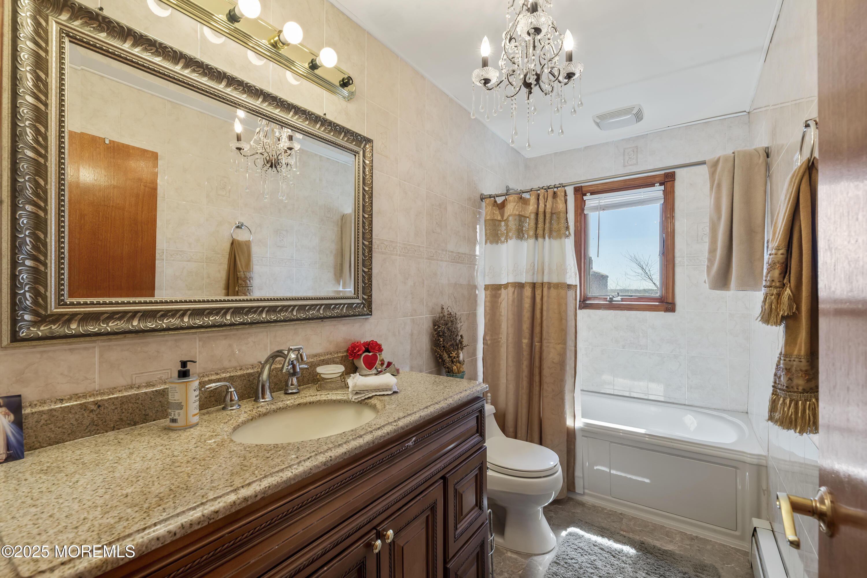 329 Front Street Union Beach, NJ 07735 - Photo 27 of 51 a bathroom with a granite countertop toilet sink and mirror