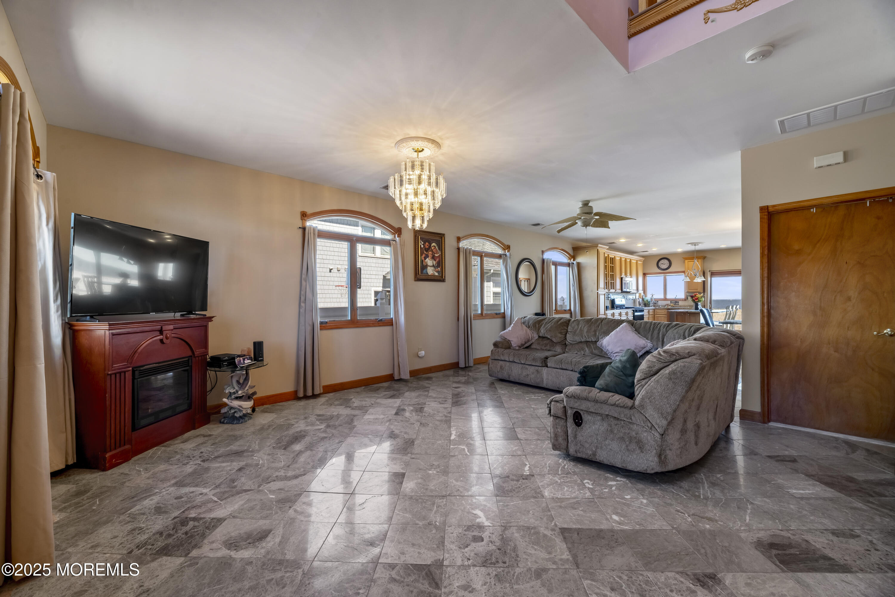 329 Front Street Union Beach, NJ 07735 - Photo 3 of 51 a living room with furniture and a flat screen tv