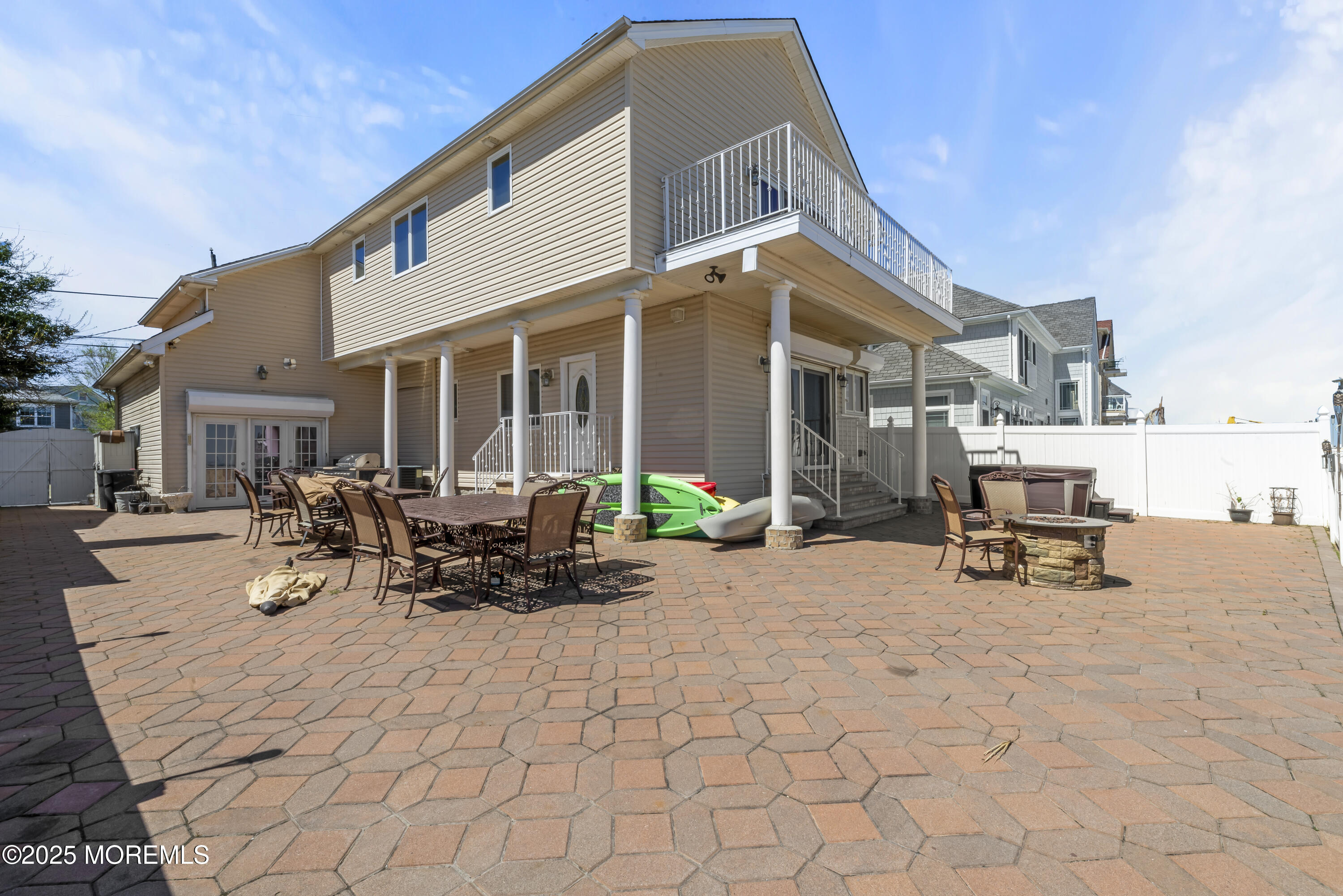 329 Front Street Union Beach, NJ 07735 - Photo 32 of 51 a view of a patio with a table and chairs under an umbrella