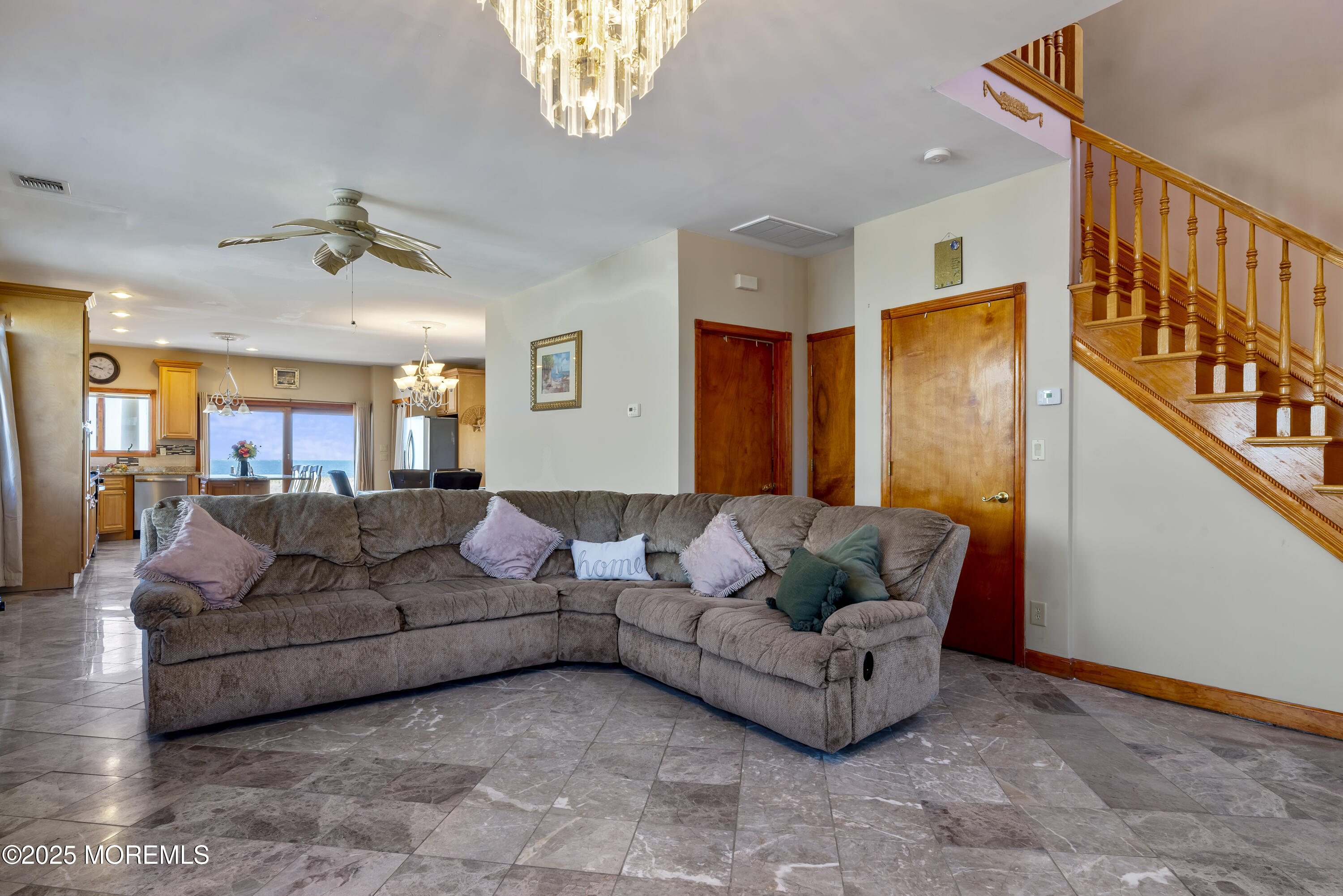 329 Front Street Union Beach, NJ 07735 - Photo 4 of 51 a living room with furniture and a chandelier