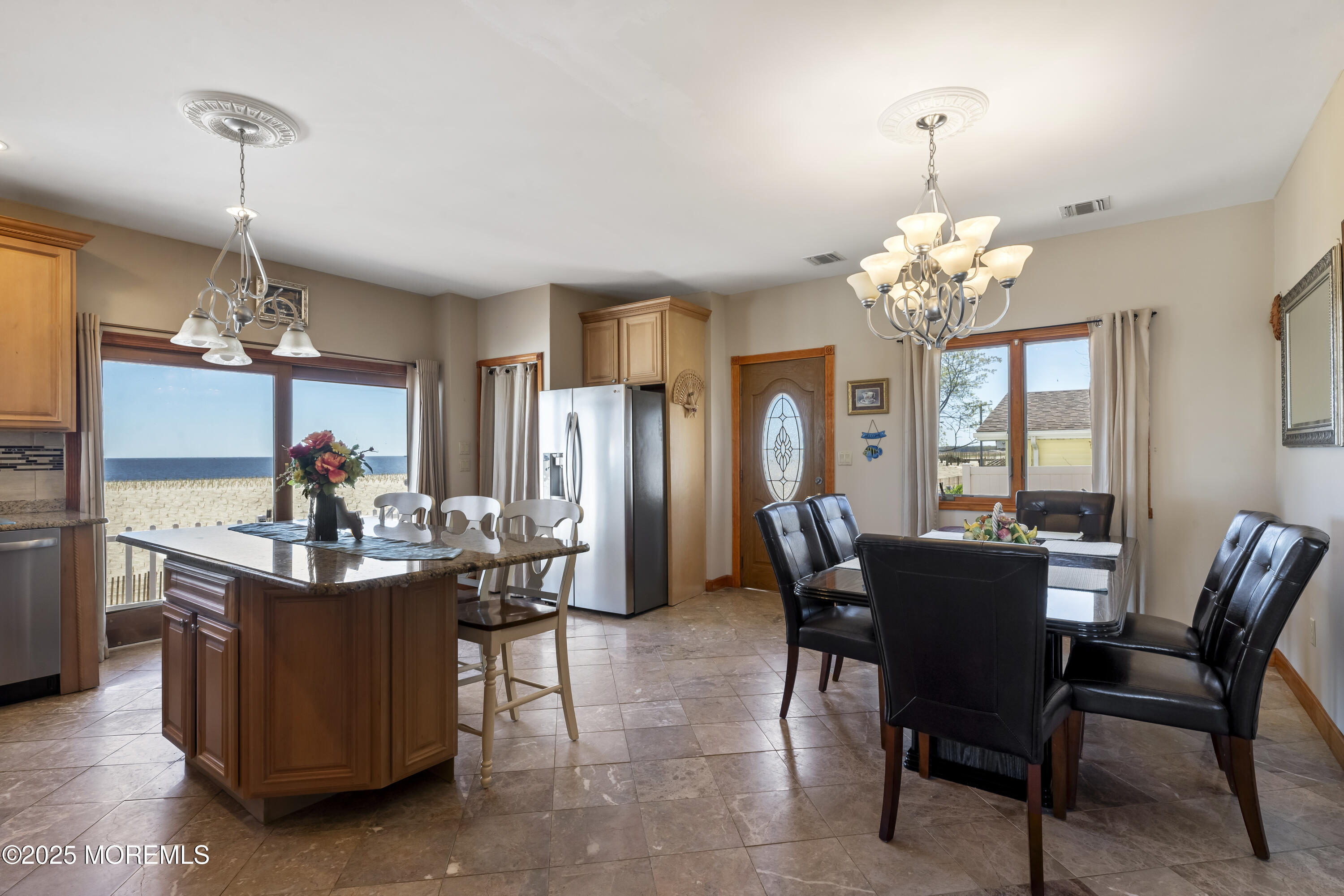 329 Front Street Union Beach, NJ 07735 - Photo 10 of 51 a view of a dining room with furniture a chandelier and kitchen view