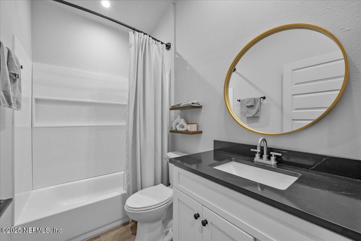 3514 Weaver Road Palatka, FL 32177 - Photo 12 of 30 a bathroom with a sink a toilet and a mirror