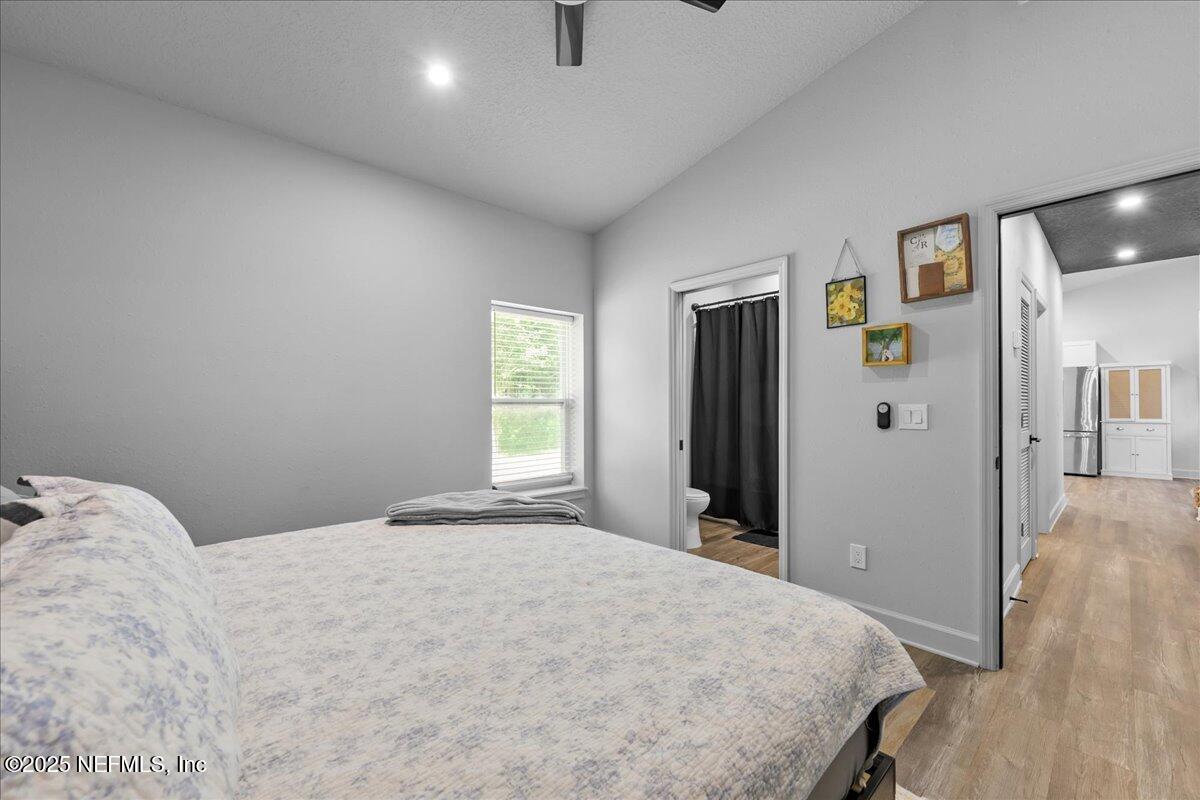 3514 Weaver Road Palatka, FL 32177 - Photo 18 of 30 a bedroom with a bed and wooden floor