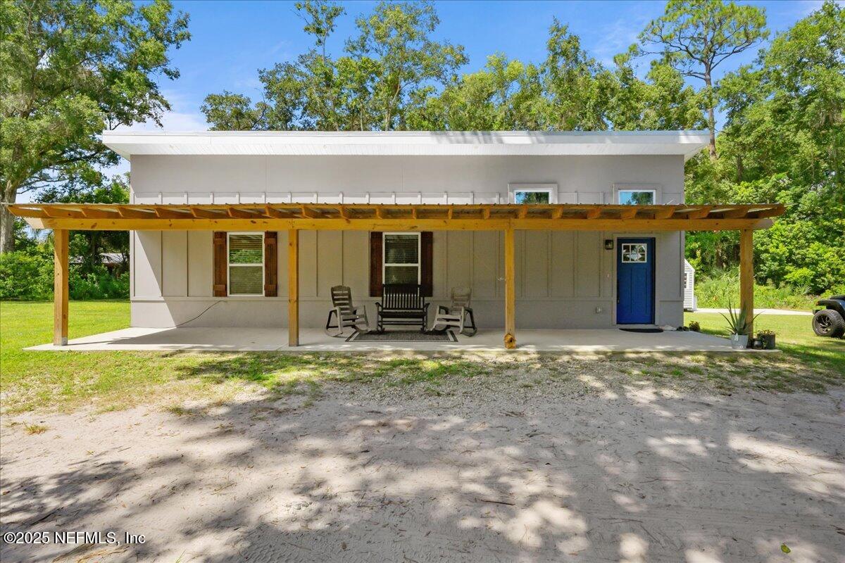 3514 Weaver Road Palatka, FL 32177 - Photo 3 of 30 a view of a house with backyard and porch