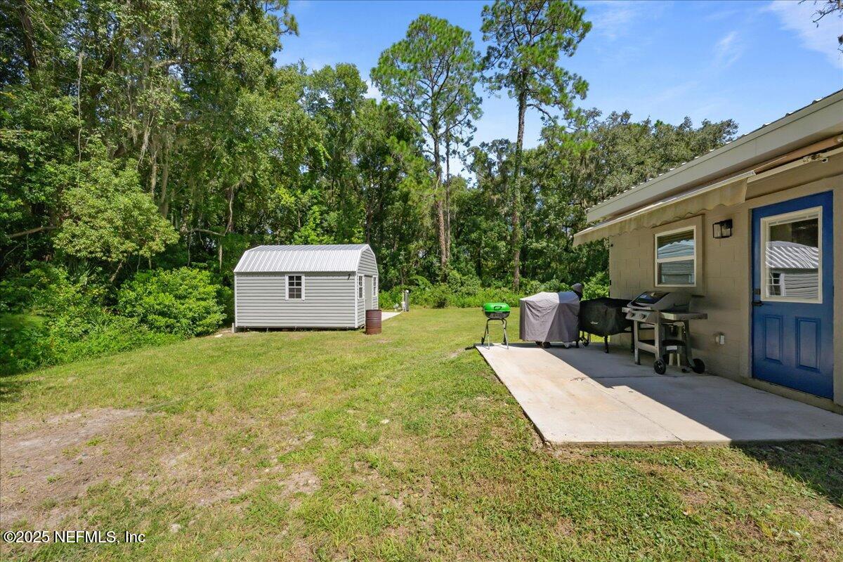 3514 Weaver Road Palatka, FL 32177 - Photo 6 of 30 a view of a backyard with a patio