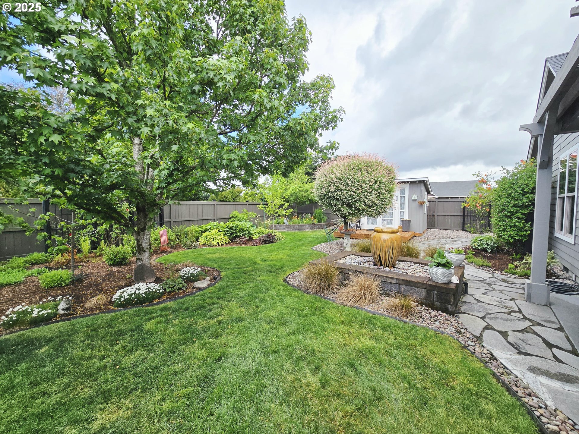 1228 South 40th Place Springfield, OR 97478 - Photo 6 of 40 a view of a house with backyard and sitting area