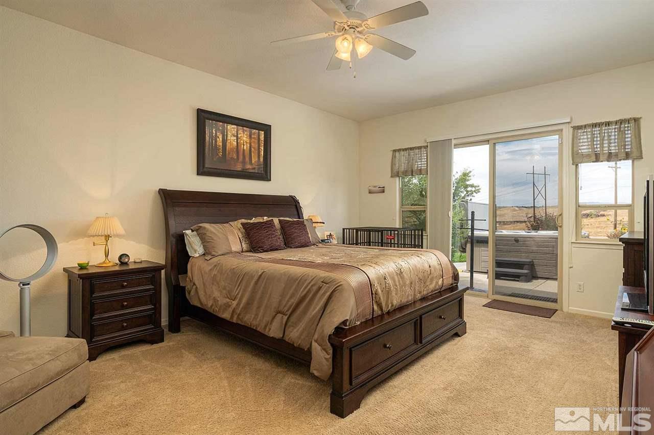 1170 South University Reno, NV 89512 - Photo 11 of 14 a spacious bedroom with a bed and cabinets