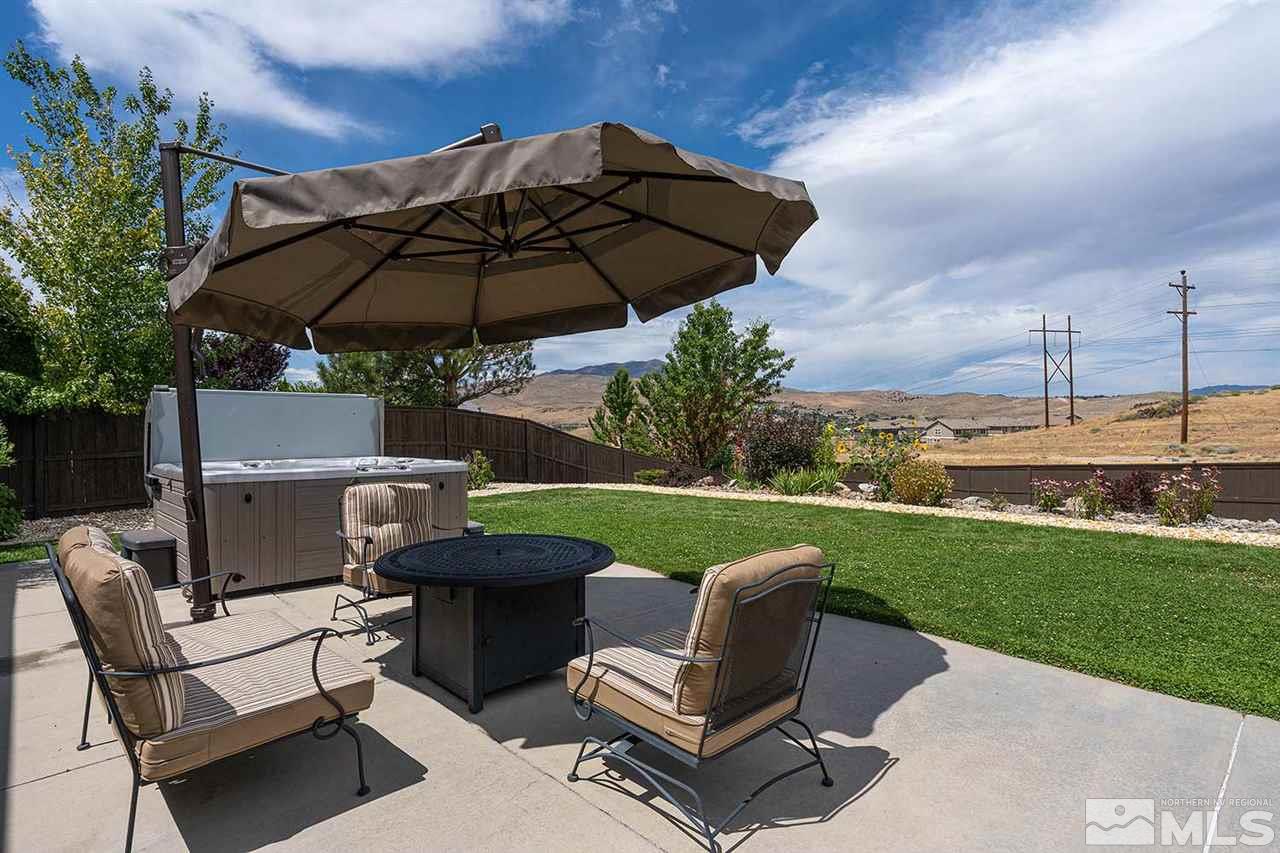 1170 South University Reno, NV 89512 - Photo 5 of 14 a view of a patio with a table chairs and a umbrella