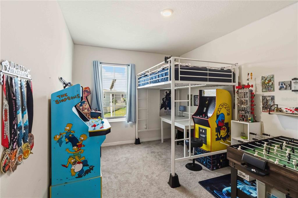 8354 Hardy Bay Loop Wesley Chapel, FL 33545 - Photo 18 of 32 a view of a room with gym equipment