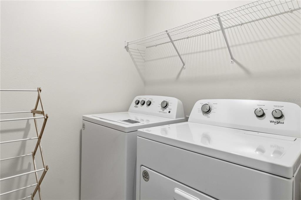 8354 Hardy Bay Loop Wesley Chapel, FL 33545 - Photo 23 of 32 a utility room with dryer and washer