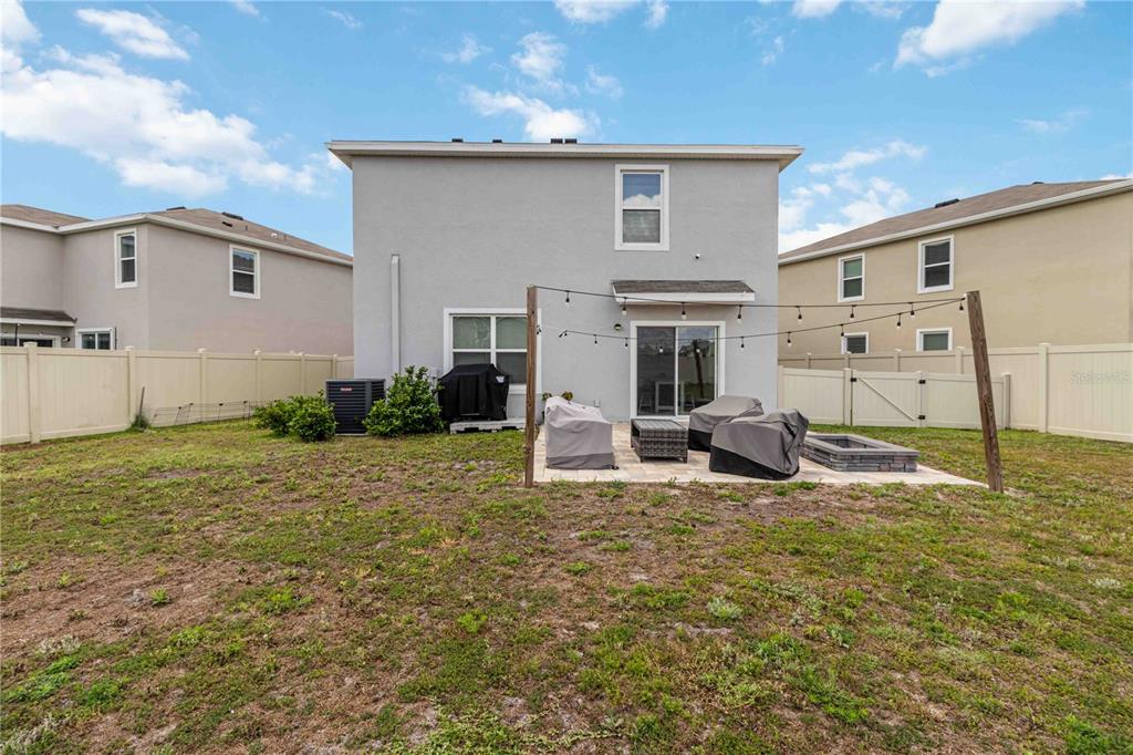 8354 Hardy Bay Loop Wesley Chapel, FL 33545 - Photo 24 of 32 a view of a house with backyard