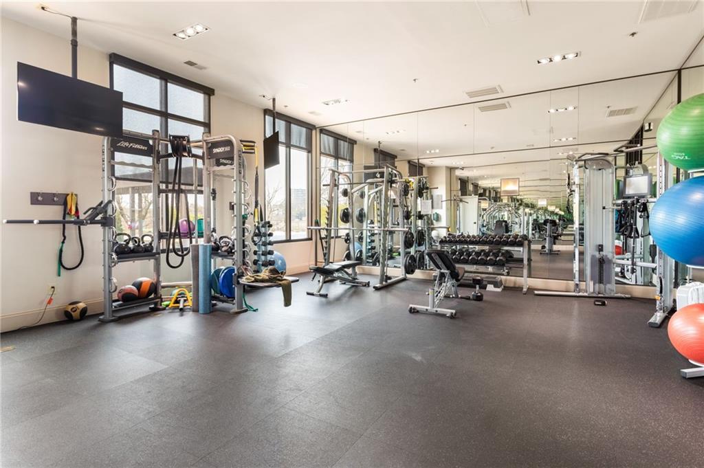 2255 Peachtree Road Northeast, Unit 326 Atlanta, GA 30309 - Photo 25 of 37 a view of a room with gym equipment