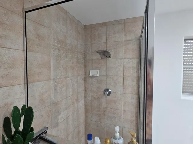 a view of a backyard with sitting area