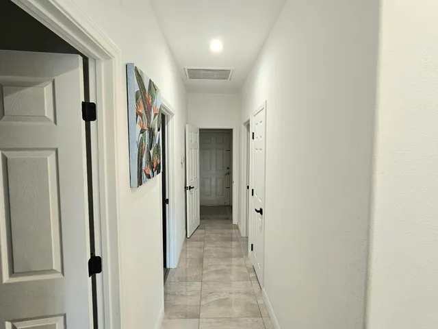 a room with a sink and cabinets