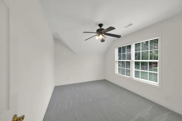 a view of a room with wooden walls
