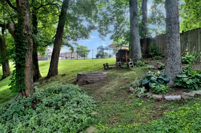 a view of a swimming pool with a lounge chair