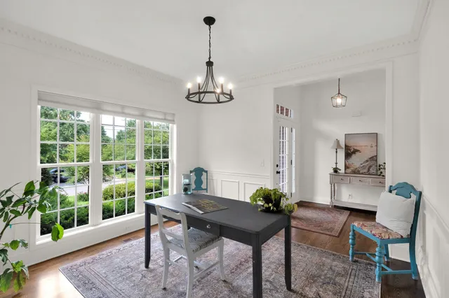 a view of a dining room with furniture window and wooden floor