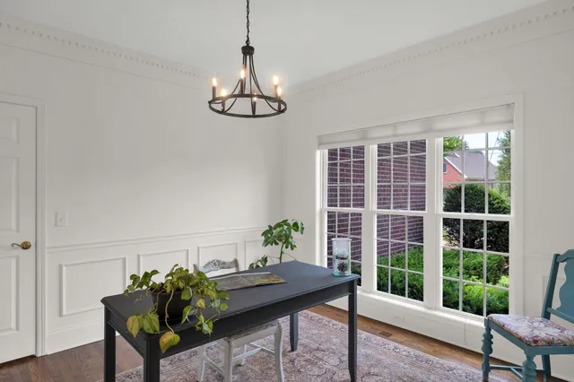 a view of a livingroom with furniture and a window