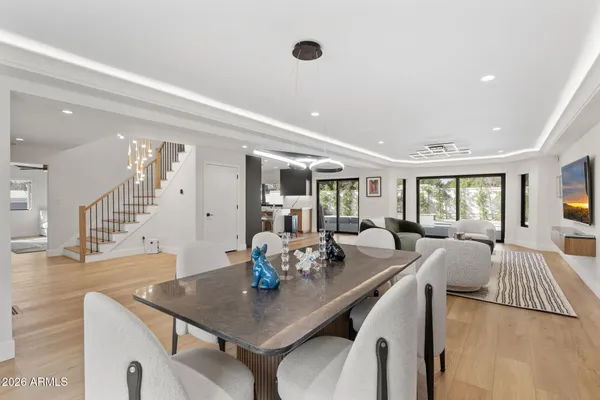a view of a dining room with furniture and wooden floor