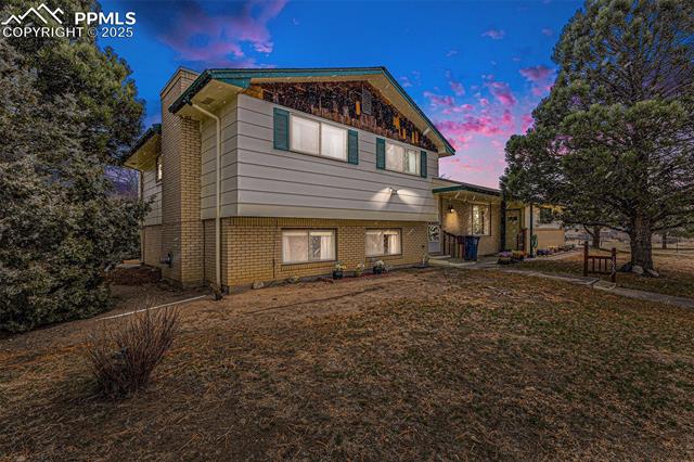 1653 Cragin Road Colorado Springs, CO 80920 - Photo 2 of 27 Split level home with brick siding