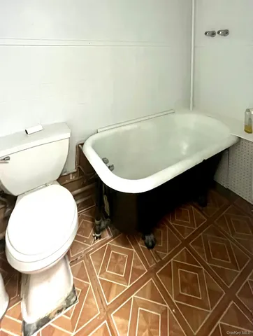 a bathroom with a toilet and a sink