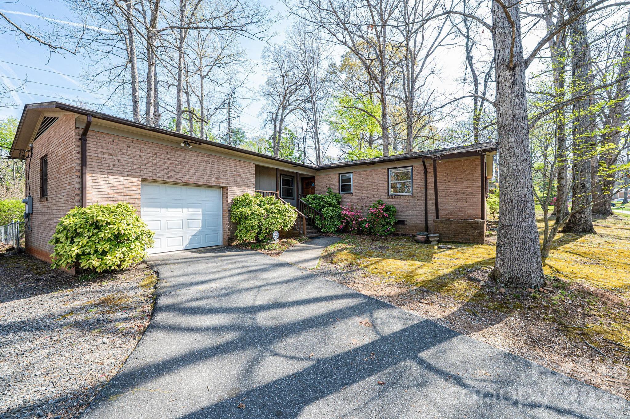 781 23rd Avenue Northeast Hickory, NC 28601 - Photo 1 of 41 a view of a house with backyard and sitting area