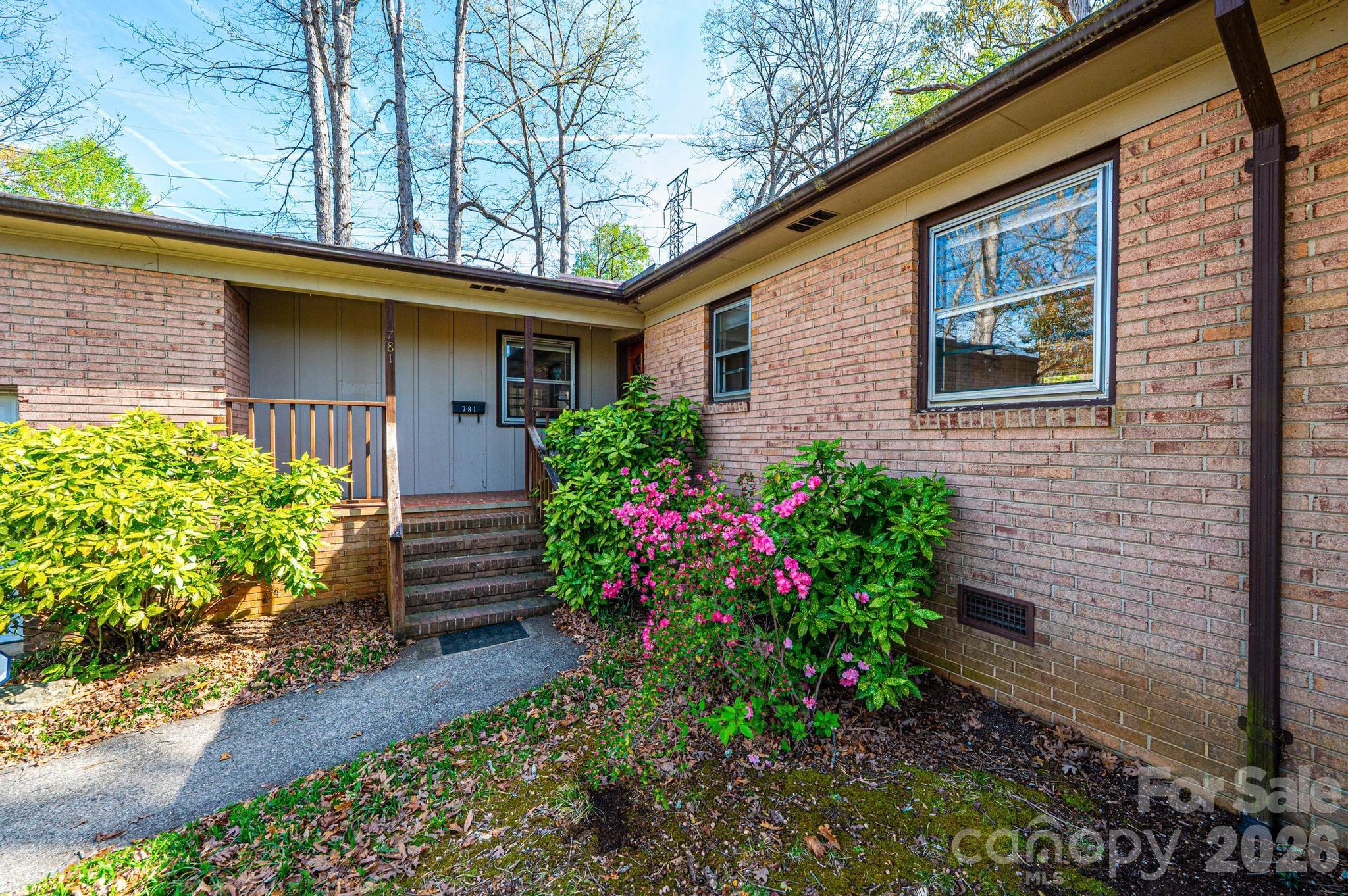 781 23rd Avenue Northeast Hickory, NC 28601 - Photo 13 of 41 a front view of a house with a garden