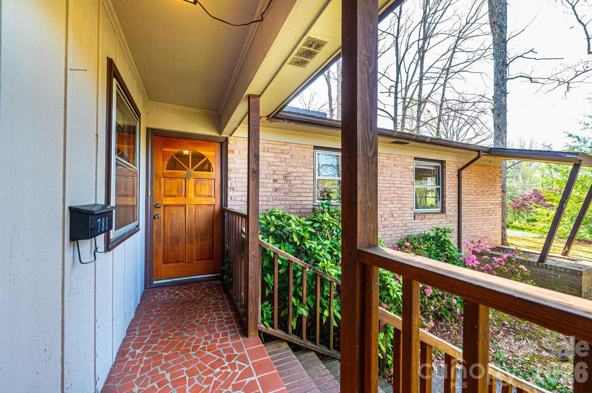 781 23rd Avenue Northeast Hickory, NC 28601 - Photo 15 of 41 a view of a porch with wooden floor and stairs