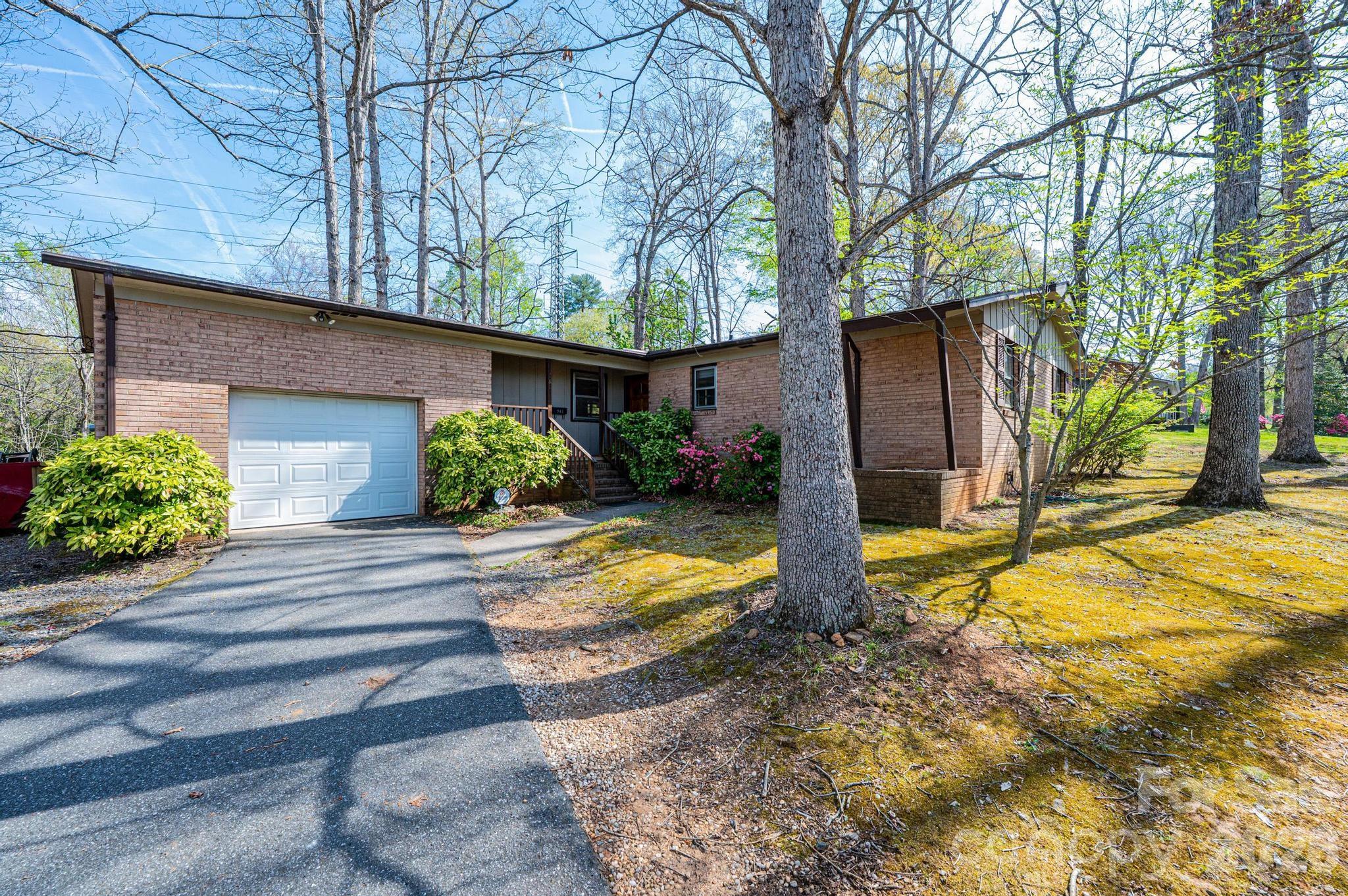 781 23rd Avenue Northeast Hickory, NC 28601 - Photo 2 of 41 a view of yellow house with a yard and potted plants